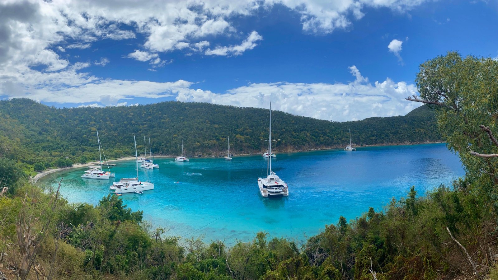 Catamarans anchored in turquoise Caribbean bay